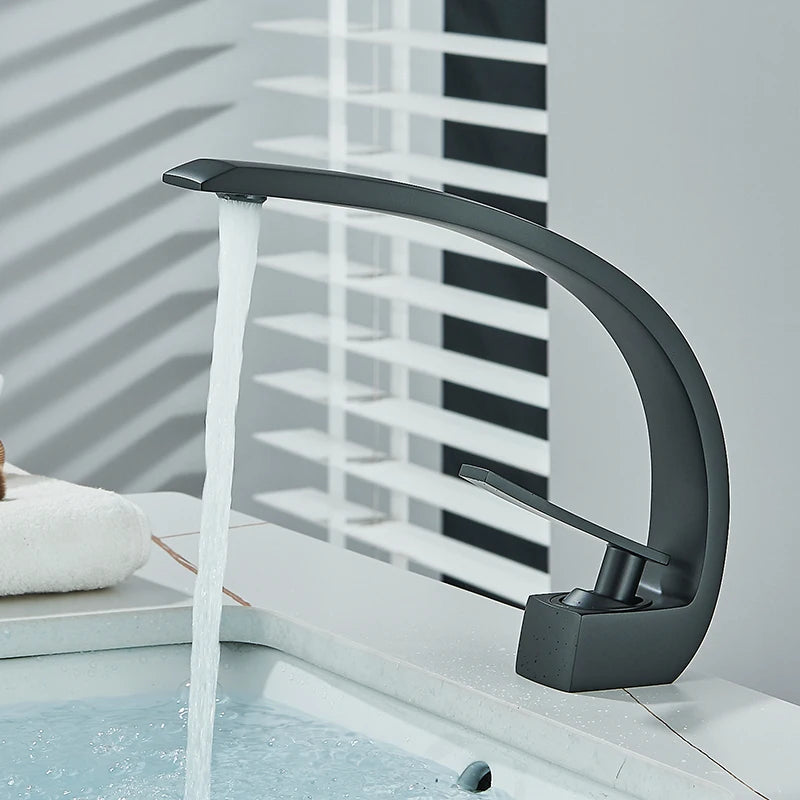 Brass Bathroom Faucet Basin Sink Faucet Single Handle Cold and Hot Mixer T
aps Beautiful Curve Design Deck installation